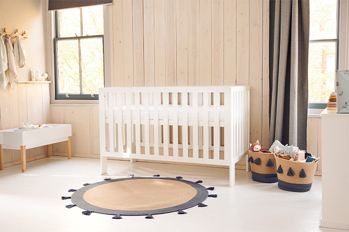 white cot bed in rustic nursery