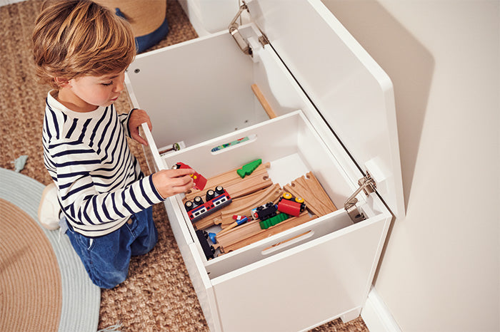 White toy box with sliding internal tray for small toys