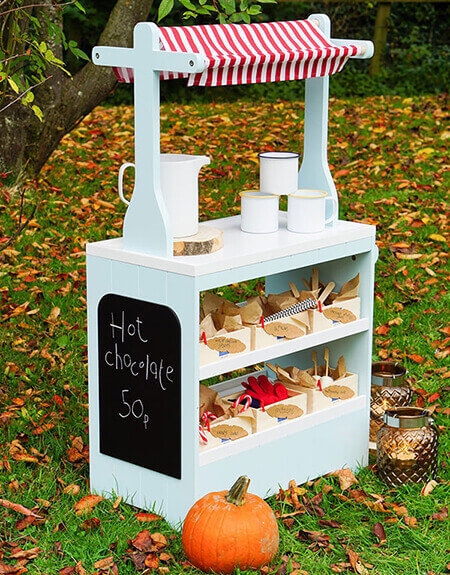 Set up a children's outdoor hot chocolate bar for hand warming role play fun