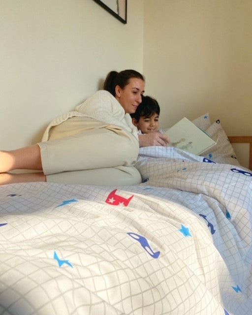 Mum and son on superhero bedding
