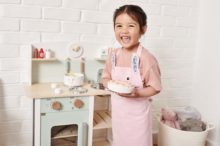 wooden play kitchen and toy baking set