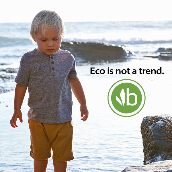 "Eco is not a trend" quote on image of boy at beach at tidepools