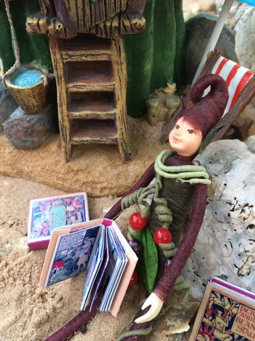 Pebbles reading three bears on the beach