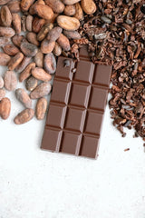 Chocolate bar, cacao beans and nibs