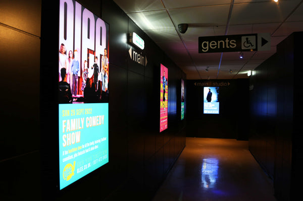 digital screens in the interior of Glee Club 