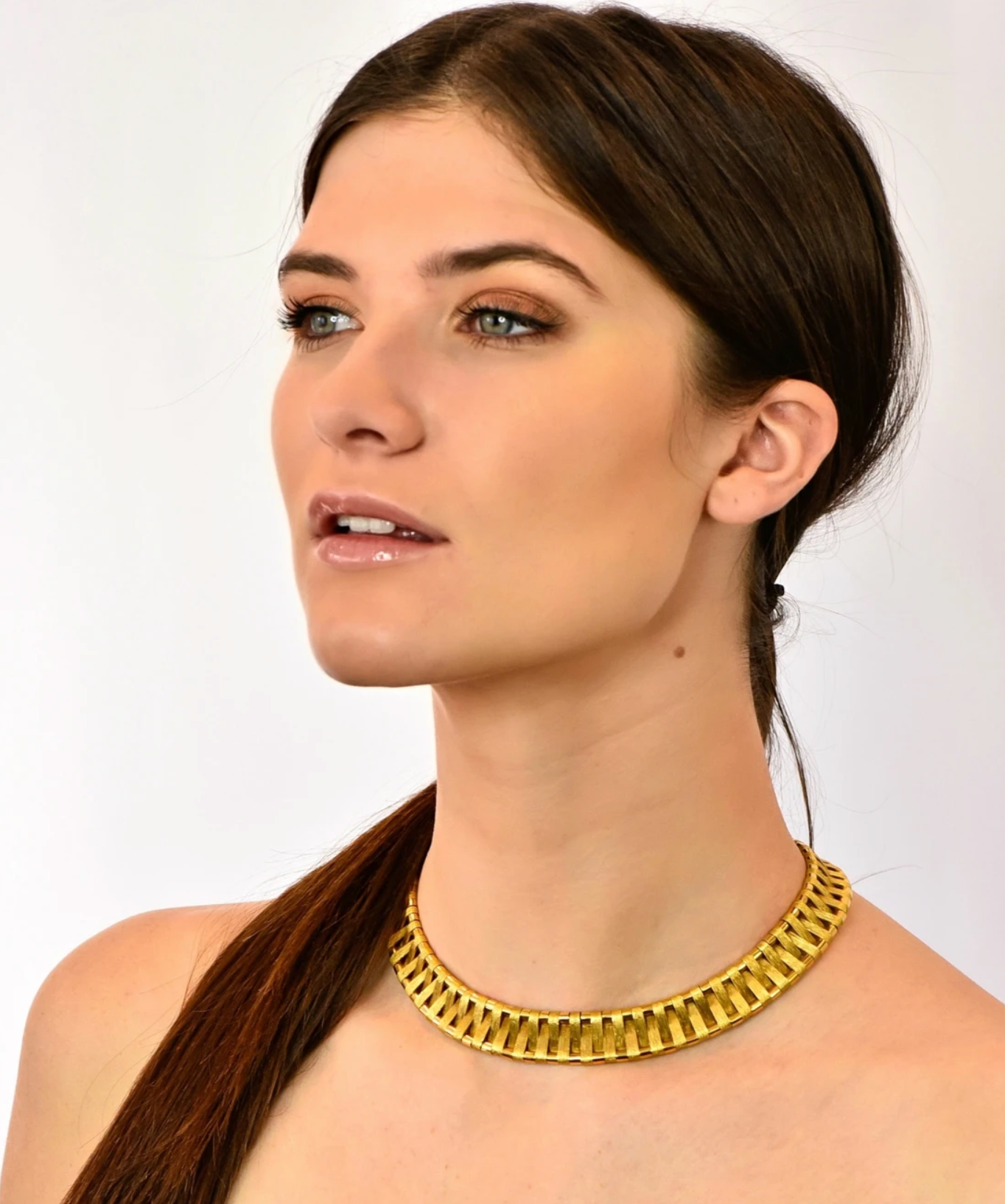 Model wearing Cartier 18 Karat Gold Egyptian Inspired Collar Necklace Vintage Jewelry