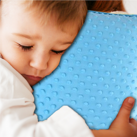 kid sleeping with his calming vibrating pillow