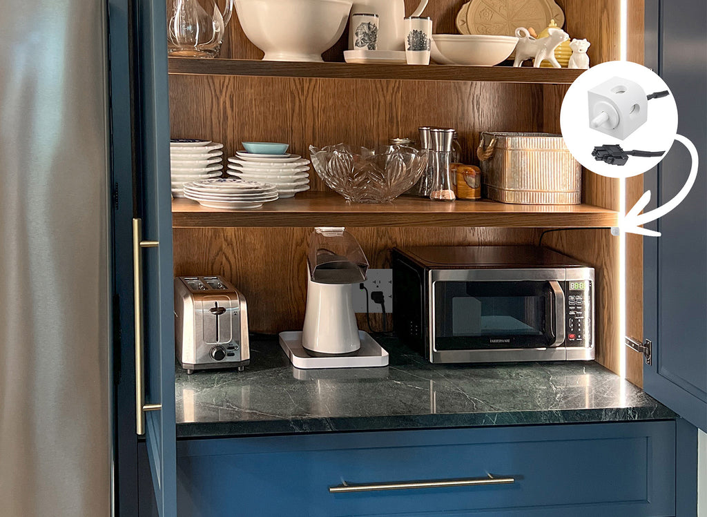 Coffee appliances and a toaster are stored in an appliance garage featuring the Safety Interlock Disconnect with Corner Mount Limit Switch.