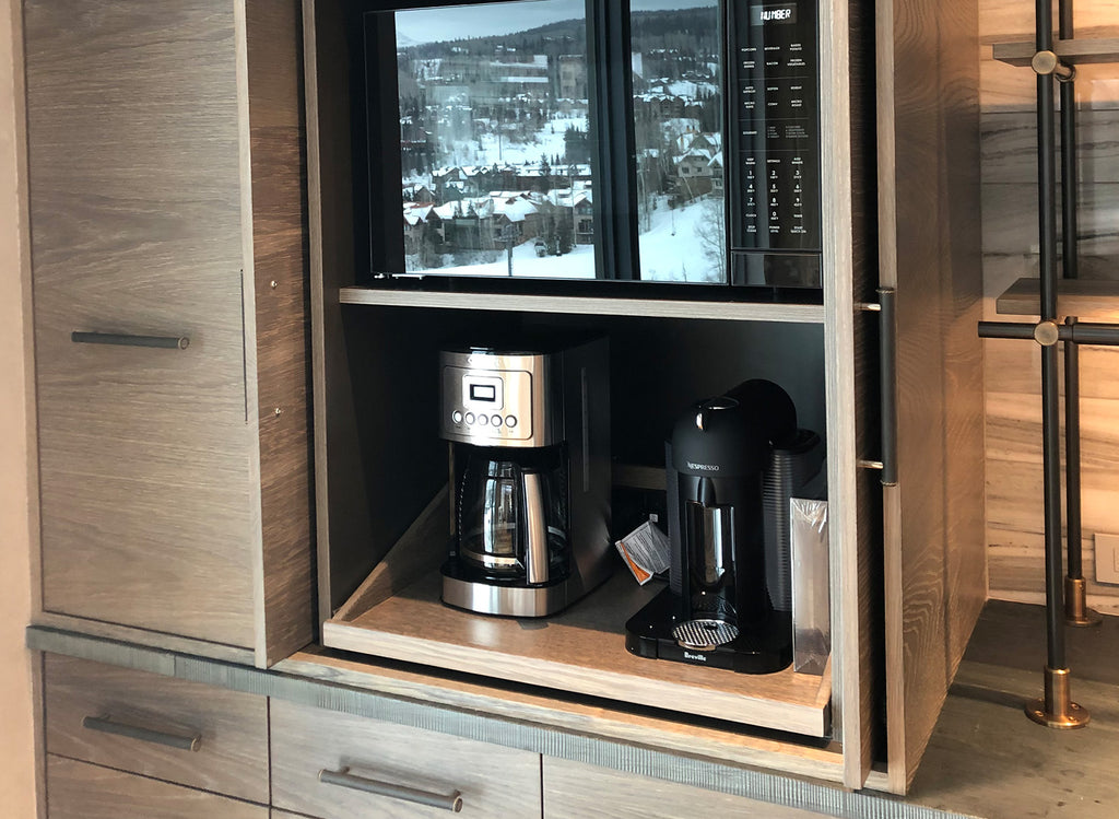 A modern appliance garage featuring a pullout tray for easy storage and access.