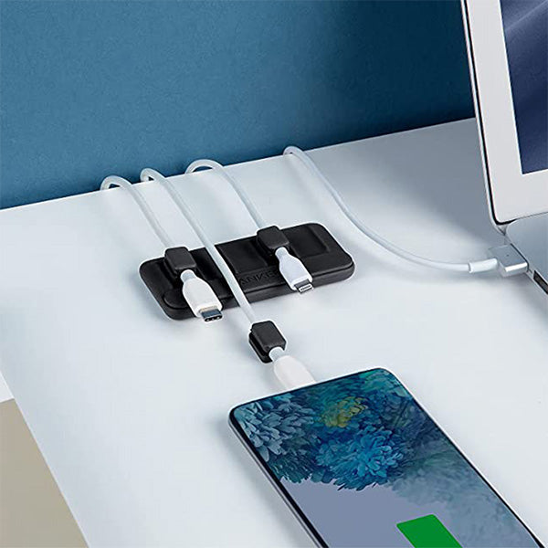 Three charging cords organized and secured by magnetic cable clips.