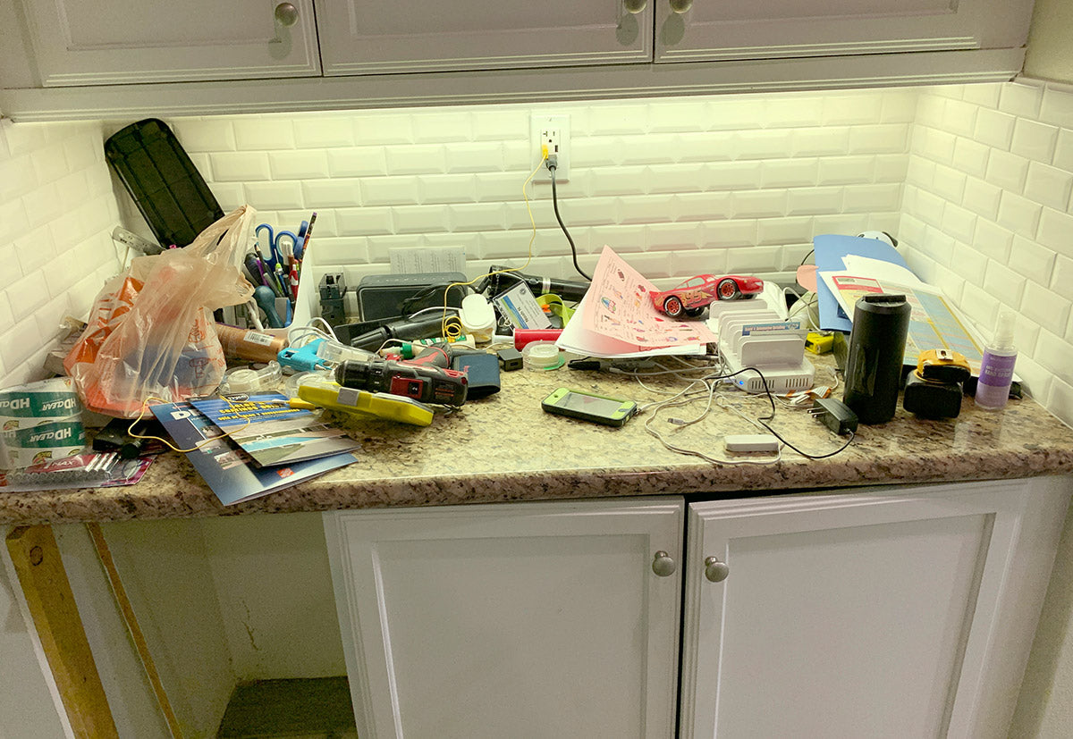 Messy kitchen counter before Docking Drawer