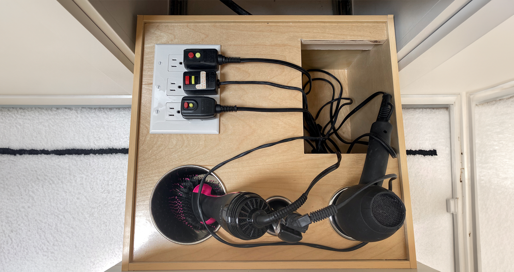 DIY bathroom vanity drawer installed with the outlets installed facing up, posing a safety hazard.