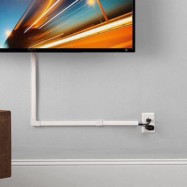 White cord cover concealing the power cables of a flat-screen TV.