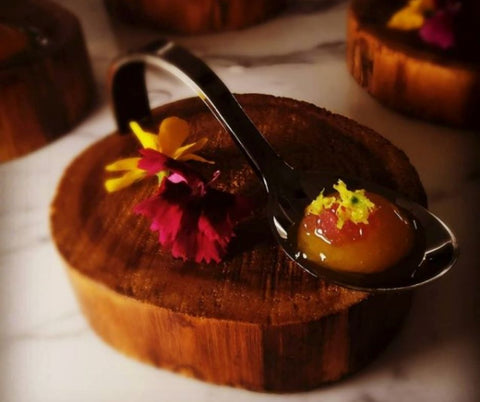 Chef Kieran Jr Genge showcases a pallet cleansing course from his degustation menu of Reverse Spherification Of Mango, Blackberry and Lemon.