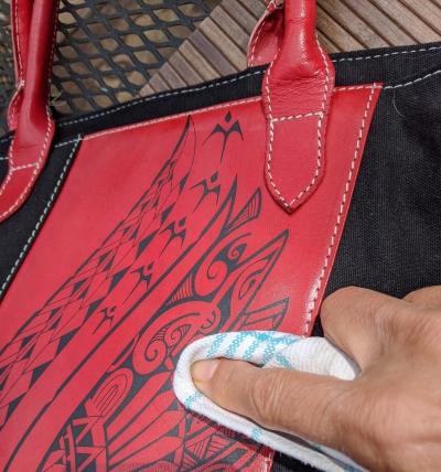 Spread sanitizer over the Nakoa leather Polynesian tattoo art
