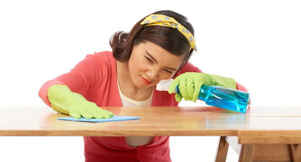 woman cleaning table