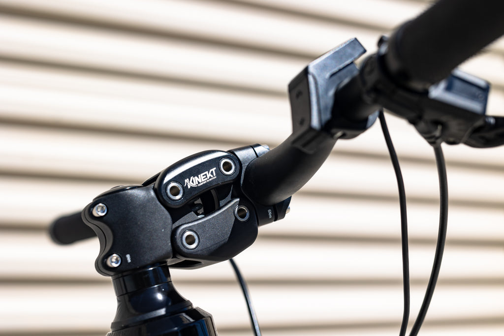 Detail photo of a Cirrus Cycles Kinect Suspension stem mounted on a FLX Babymaker II stealth electric bike