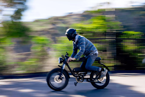 man riding black electric bike that looks like a motorcycle