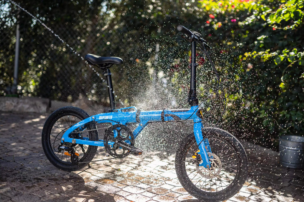 spraying ebike with water