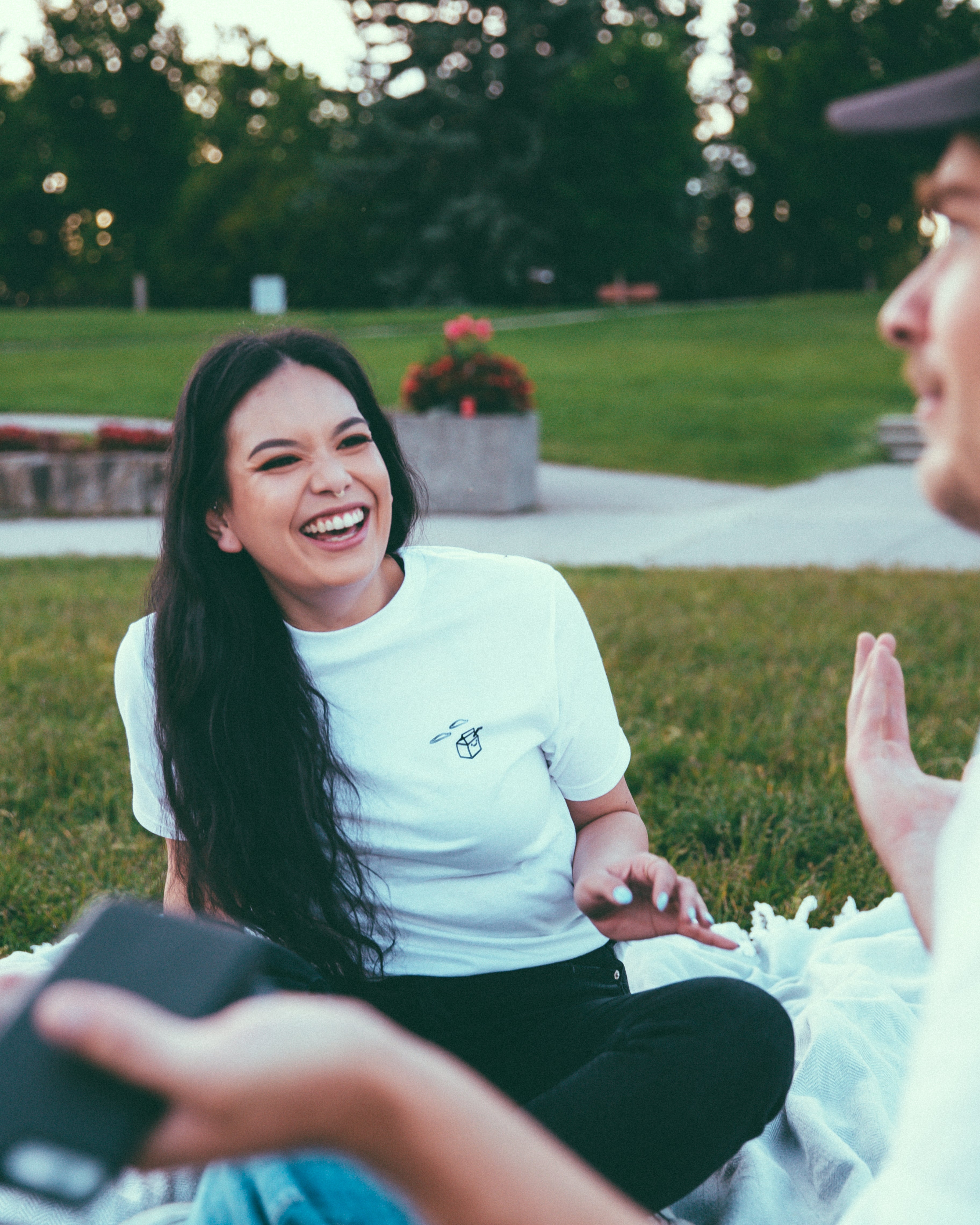 woman laughing in thankyou x milk jar shirt