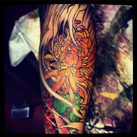 flower blossom tattoo by Master Mike California tattoo artist