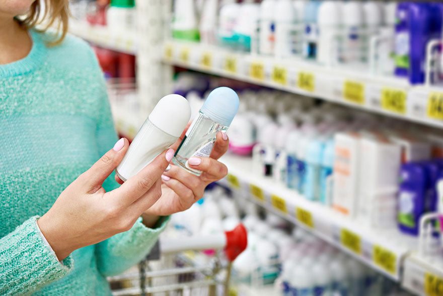 comparing two deodorants store aisle