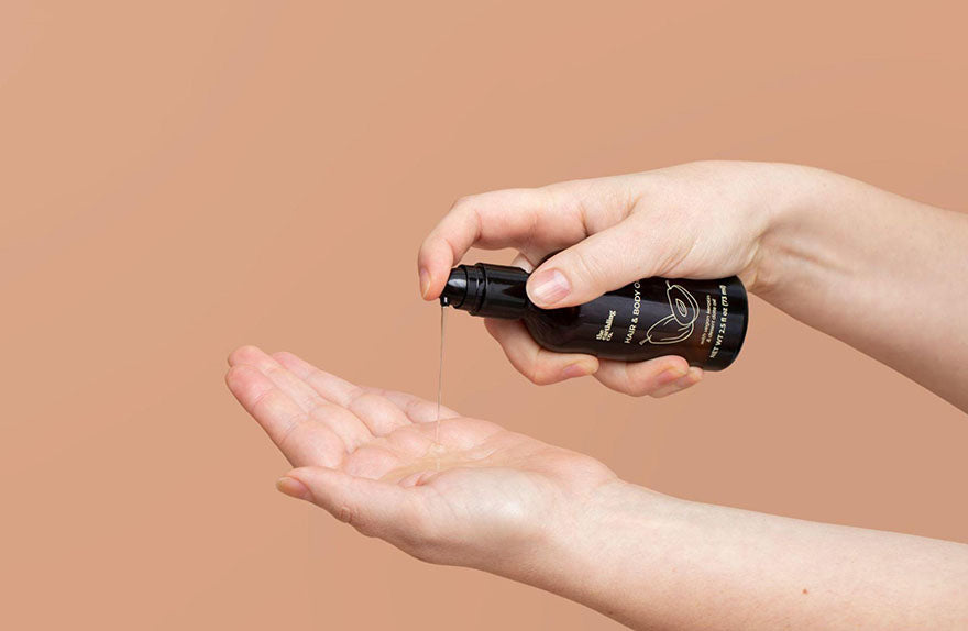 pouring hair body oil