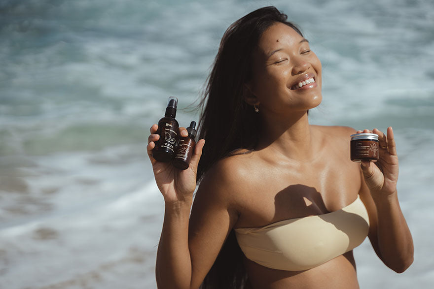 woman holding up moisturizing products