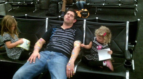 Tired Dad with Daughters and Stickers