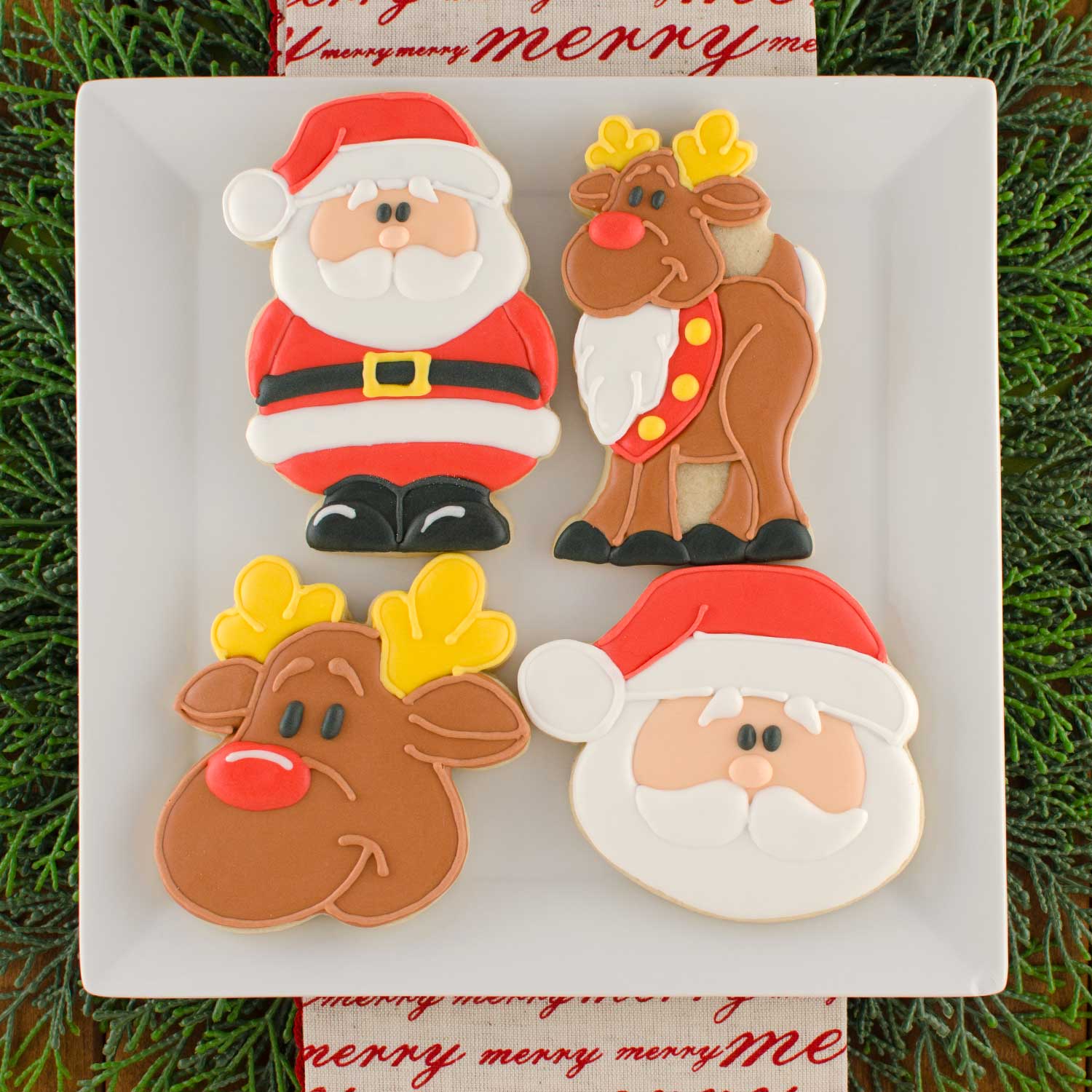 https://cdn.shopify.com/s/files/1/2355/4701/products/santa-reindeer-cookies_c3ea8f56-ba3c-4474-a849-c8fecfa69364.jpg?v=1599787281