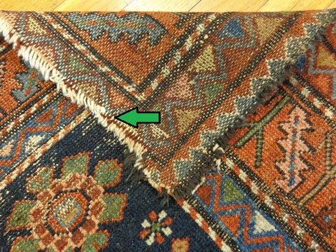 Worn rug fringe