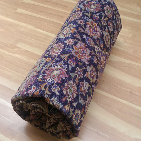 Rolling a Large Persian rug
