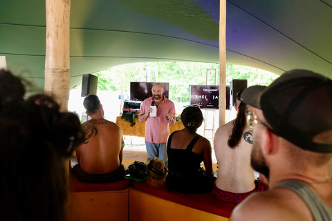 Topaz Adizes, founder of The Skin Deep, speaking to a crowd at the Bonnaroo music festival