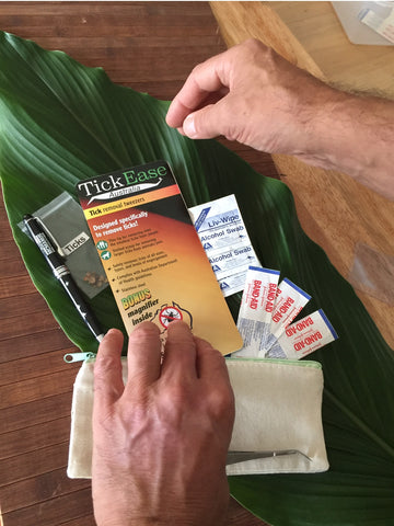 Creating-your-Tick-Kit-with-TickEase-tweezers-disinfectant-alcohol swabs-Band-Aids™-magnifying glass-zip-lock-plastic-bags-pen-water-proof-container