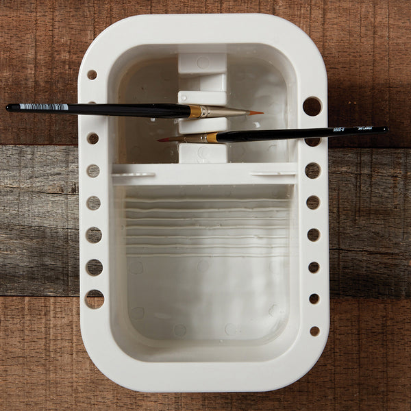 Learn how to use the brush basin - slots to hold the brushes