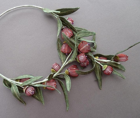 Eucalyptus Blossom necklace made by Suzette Watkins.  Glass flower beads by Bev Butler, leaves and caps by Lynne Stone