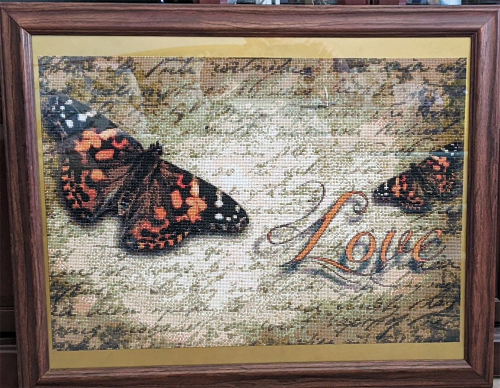 Butterflies Next To Text "Love" 