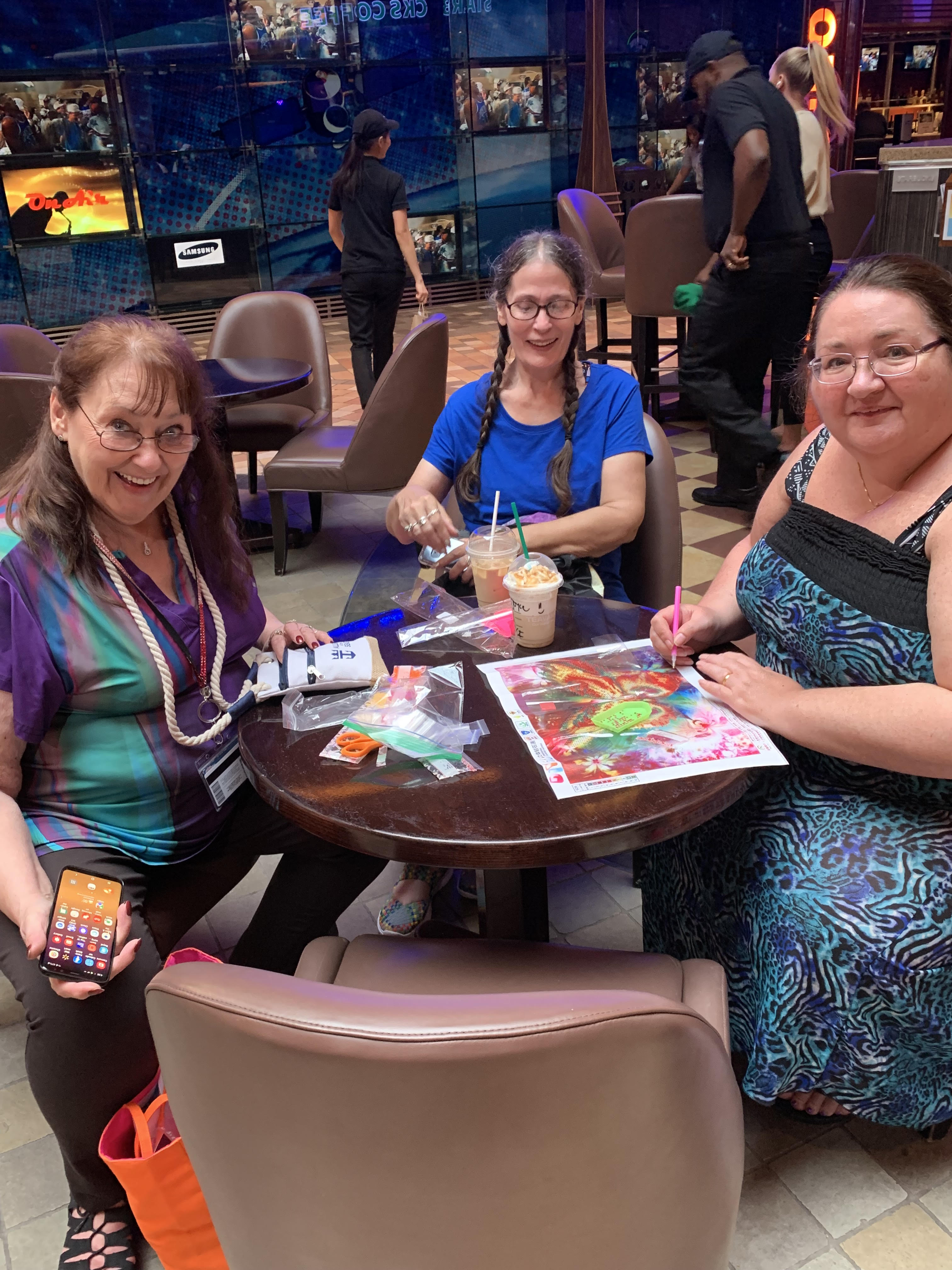 Women Smiling while Working on Paintings