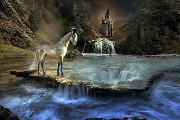 unicorn on a cliff overlooking waterfall background