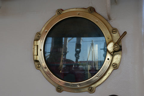 Brass porthole. Italian military training ship Amerigo Vespucci 