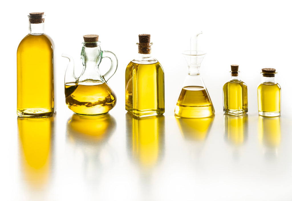 A row of oils in different bottles