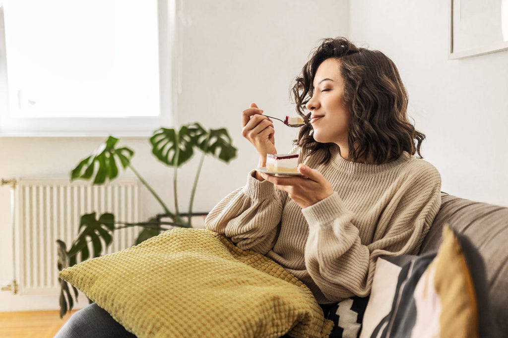 Woman savoring a sweet dessert