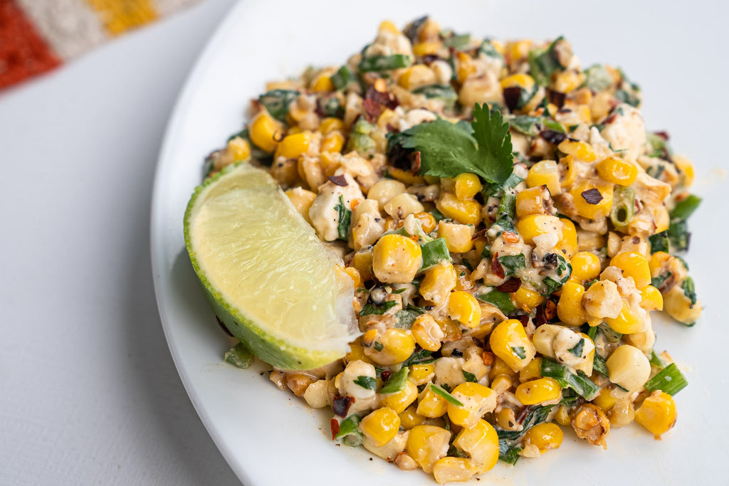 Mexican Street Corn Salad on a white plate.