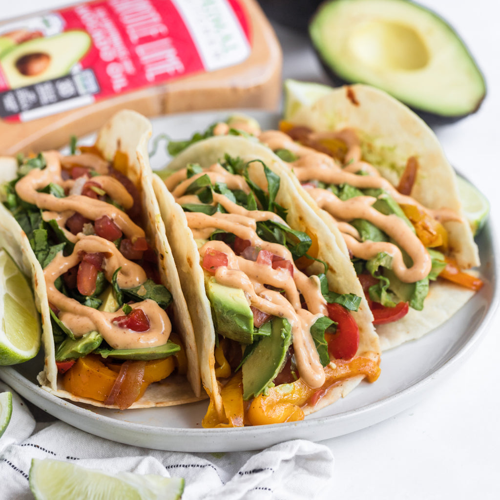 A plate of avocado veggie tacos with Chipotle Lime Mayo