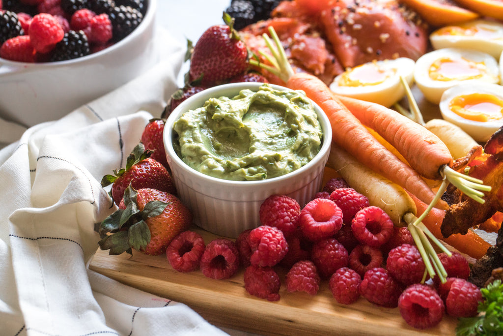 dip, fruits, and carrots on a breakfast charcuterie board