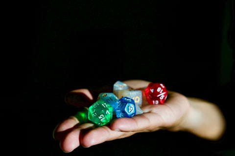 Person holding tabletop dice