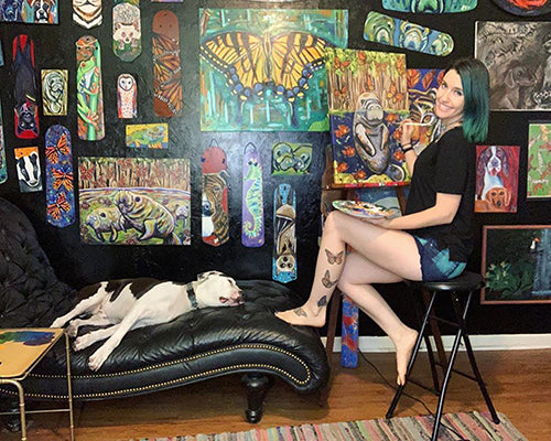 Samm painting in her studio