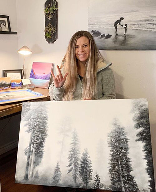 Samm painting in her studio