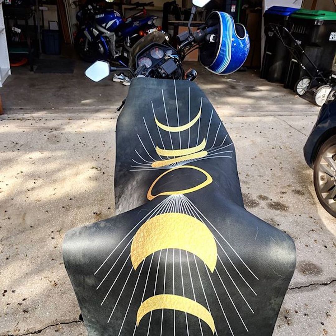 'Waxing Crescent Phases of the Moon' Big Raven Yoga mat laid out on a motorcycle to dry