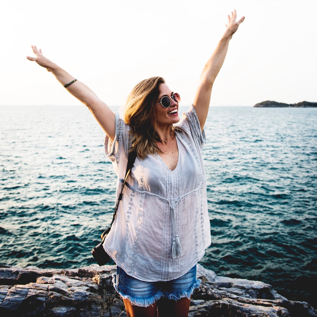 Happy woman at the beach